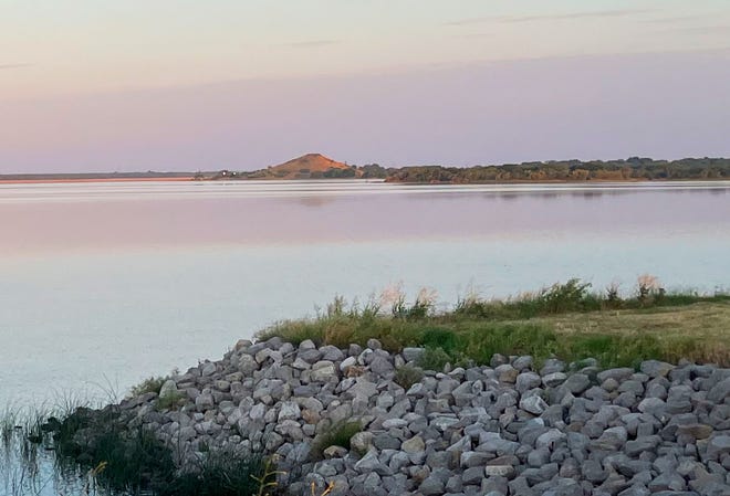 Mount Murphy rises on the shores of Lake Wichita on a recent morning.  A study has ranked the lake as one of the most polluted in the country.